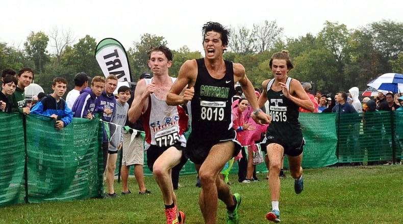 Centerville’s Ben Burkett (7725) battles Dublin Coffman’s Alex Dediu to the finish line at the Mason cross country invitational Saturday. Burkett finished third behind Middletown’s Conant Smith and Dediu. Contributed photo / Greg Billing