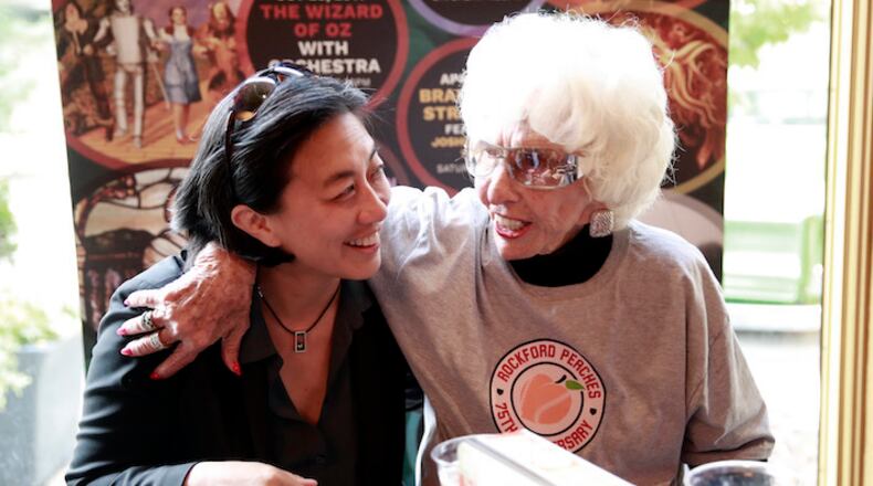 Kim Ng, Major League Baseball senior vice-president for baseball operations, and right, Maybelle Blair, who played in 1948 for the Peoria Redwings, during a celebration of the Rockford Peaches' 75th Anniversary. (Nuccio DiNuzzo/Chicago Tribune/TNS)