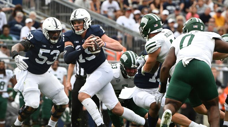 Penn State quarterback Drew Allar (15) scrambles away from Ohio linebacker Kyle Kelly (48) during the second half of an NCAA college football game , Saturday, Sept. 10, 2022, in State College, Pa. (AP Photo/Barry Reeger)