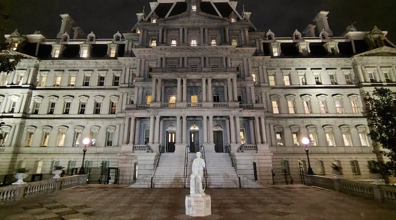 This photo provided by Will Hemsley shows a statue of Christopher Columbus standing in front of the Eisenhower Executive Office Building in Washington, Sunday, March 22, 2026. (Will Hemsley via AP)