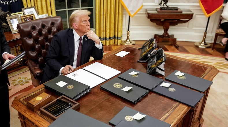President Donald Trump pauses while signing executive orders in the Oval Office of the White House in Washington on Monday, Jan. 20, 2025, following his inauguration as the 47th president. (Doug Mills/The New York Times)
