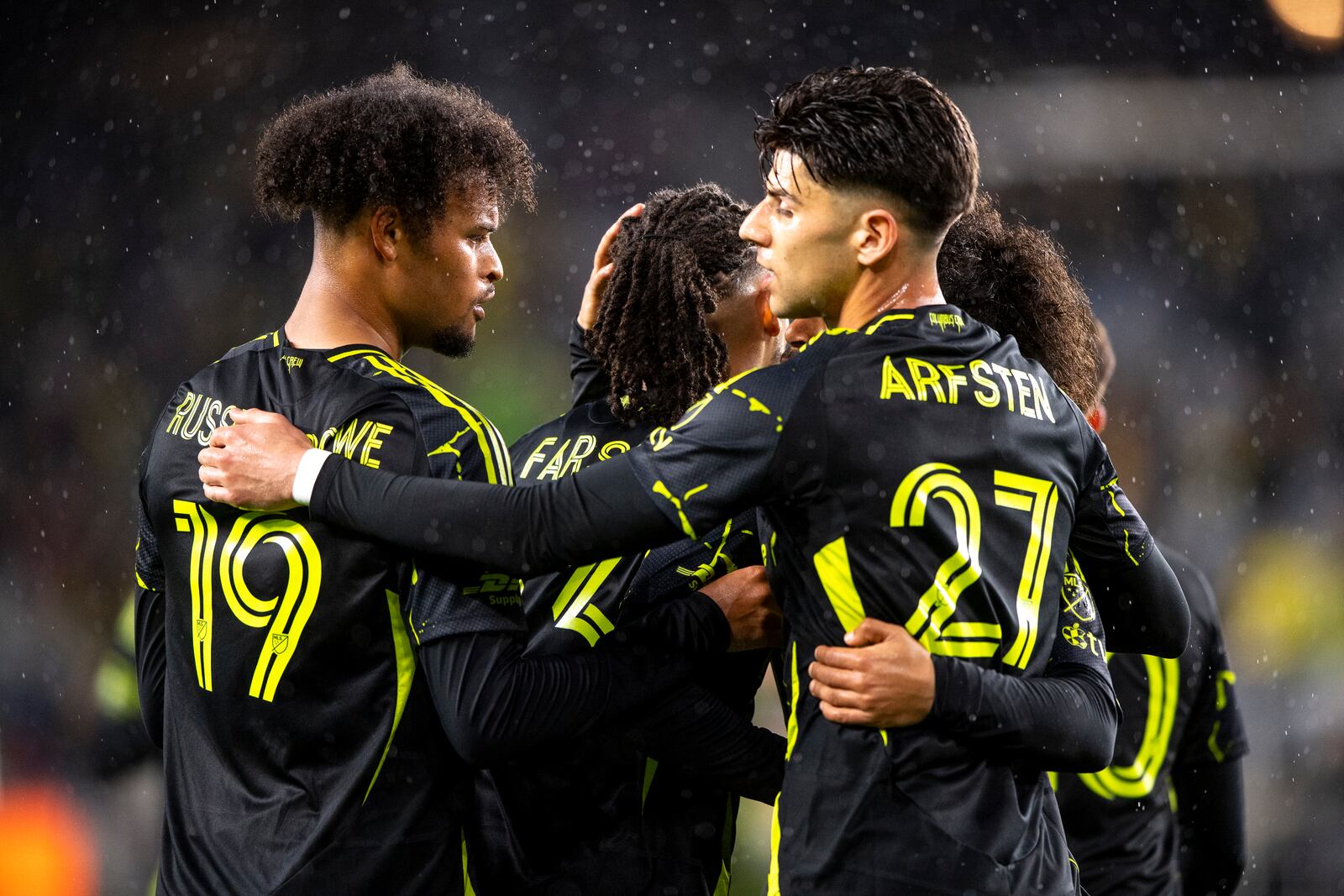 Columbus Crew forward Jacen Russell-Rowe (19) celebrates with teammates after scoring a goal during the first half of an MLS soccer match against CF Montréal, Saturday, April 5, 2025, in Columbus, Ohio. (AP Photo/Tanner Pearson)