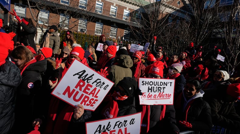 Nurses strike in front of Montefiore Hospital in the Bronx borough of New York, Tuesday, Jan. 13, 2026. (AP Photo/Seth Wenig)