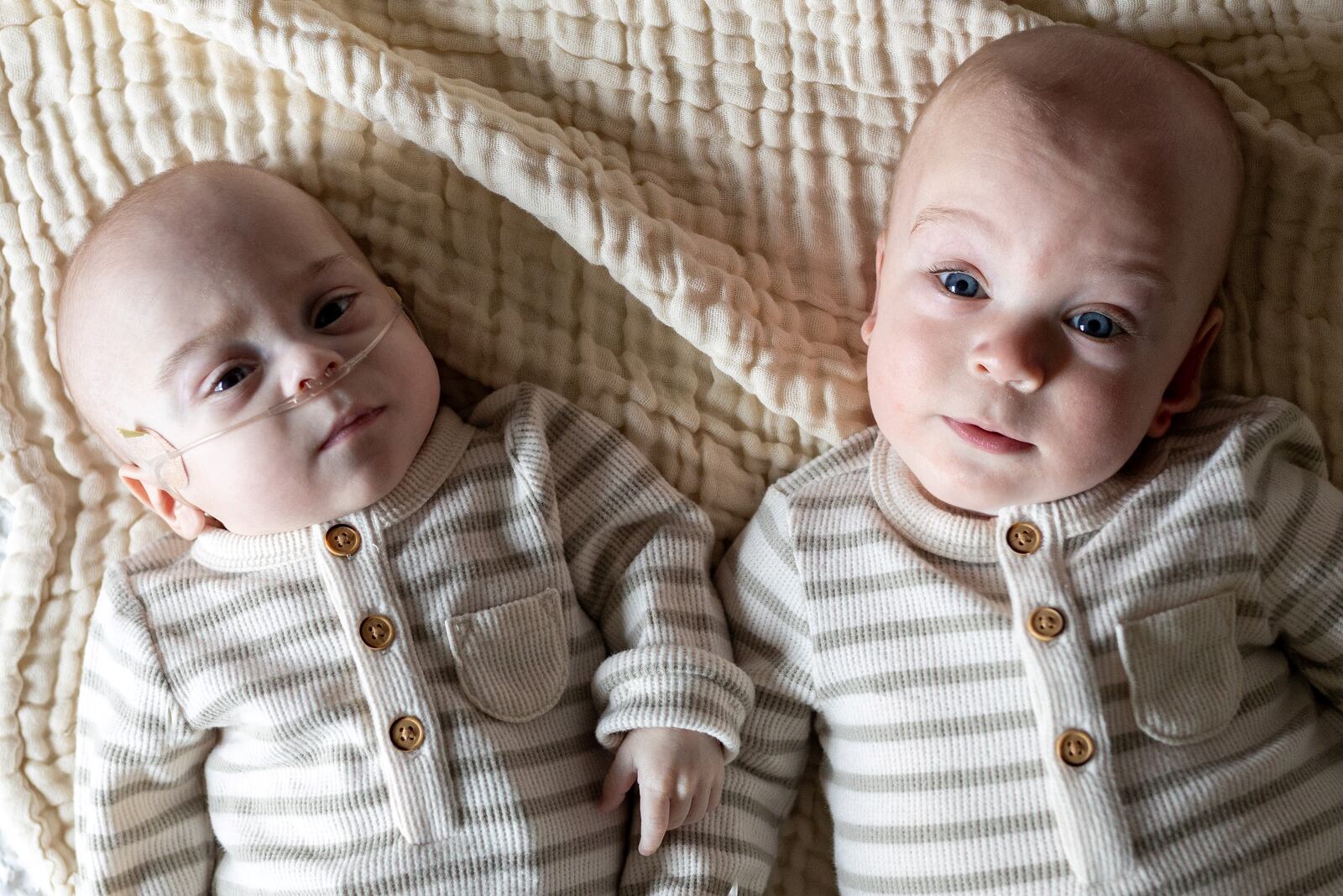 Twin baby boys Jonah (left) and Drew (right), whose parents are Cody and Halee Rudduck, of Xenia. Jonah spent 229 days in the newborn intensive care unit at Dayton Children's. Drew also spent 74 days in the NICU at Kettering Health Main Campus. Jonah and Drew were born on Jan. 24, 2025 at Kettering Health Main Campus at a little more than 27 weeks into Halee's pregnancy due to complications stemming from Twin-to-Twin Syndrome. Now, both boys are home and their parents are excited to start Christmas traditions with them, Halee said. CONTRIBUTED