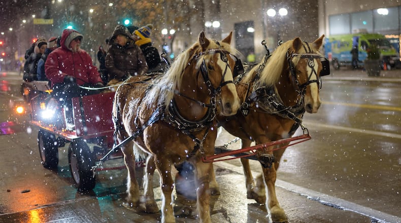The 52nd annual Dayton Holiday Festival featuring the Grande Illumination and Dayton Children’s Parade Spectacular in Lights, happened in downtown Dayton on Friday, Nov. 29, 2024. TOM GILLIAM / CONTRIBUTING PHOTOGRAPHER