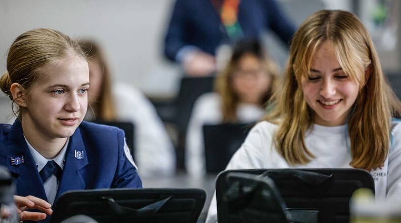 Beavercreek High School students Ki Radford, left and Hannah Wofford study in the teachers academy classroom Thursday November 21, 2024. JIM NOELKER/STAFF