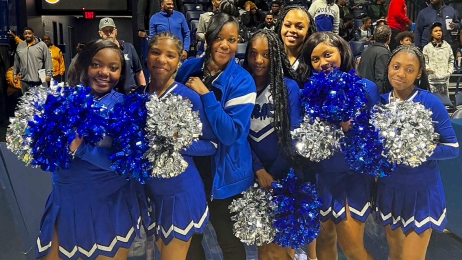 Dunbar coach Juanida Hurt poses for a photo with her cheerleading squad during a recent game. CONTRIBUTED PHOTO