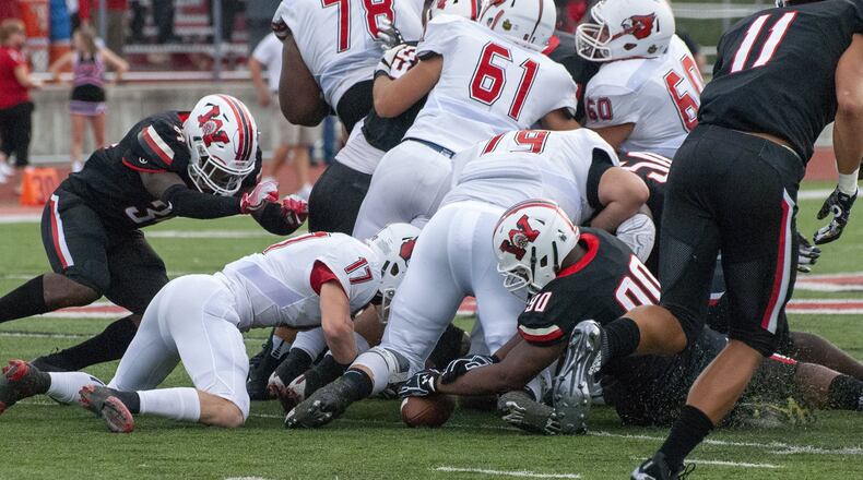 Wayne defensive lineman Audotcie Washington recovers a Colerain fumble in the first quarter, leading to an early 7-0 lead for Wayne during Friday night’s Backyard Blitz. Jeff Gilbert/CONTRIBUTED