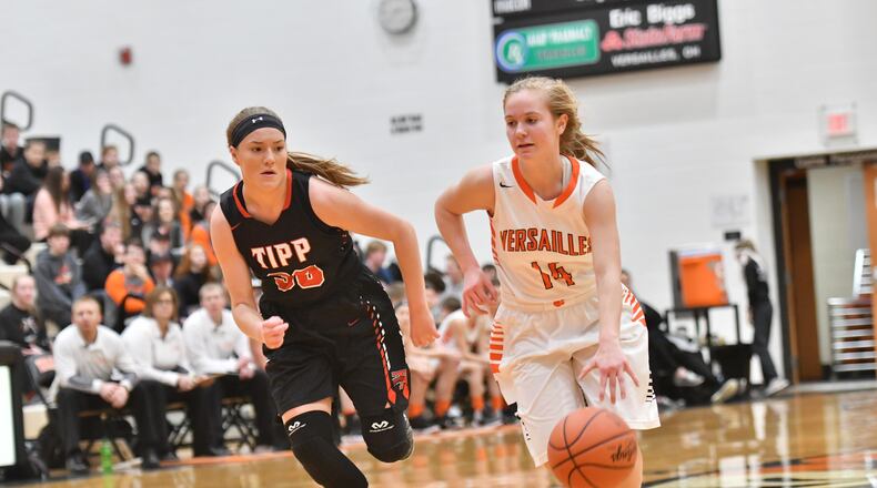 Versailles sophomore Caitlin McEldowney brings the ball up court as Tipp senior Allison Mader applies pressure. Greg Billing/CONTRIBUTED