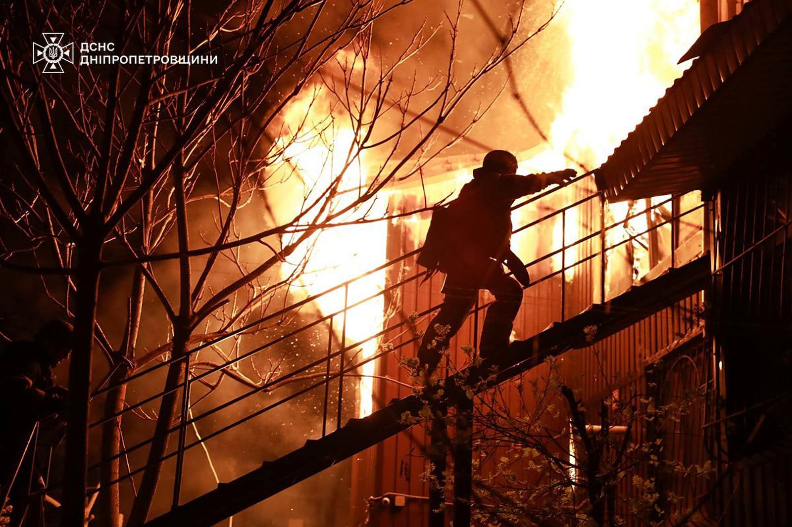 In this photo, provided by the Ukrainian Emergency Service, firefighters extinguish fire following a Russian attack in Dnipro, Thursday, April 17, 2025. (Ukrainian Emergency Service via AP)