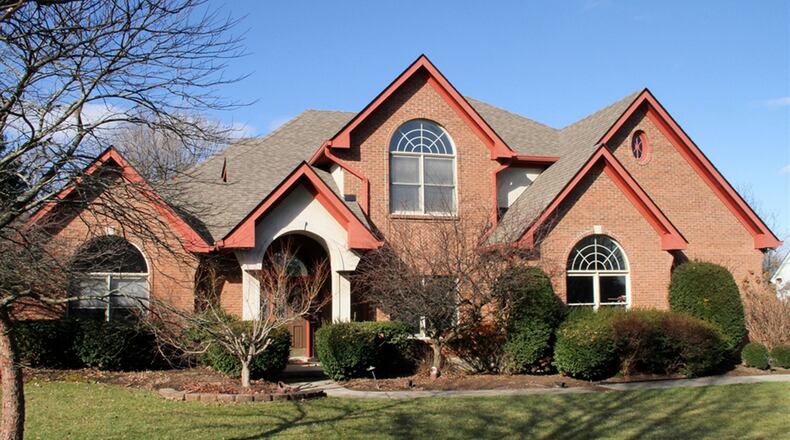 The brick 2-story has about 3,420 square feet of living space. A side-entry, 3-car garage has an extra parking pad and rear service door. CONTRIBUTED PHOTOS BY KATHY TYLER