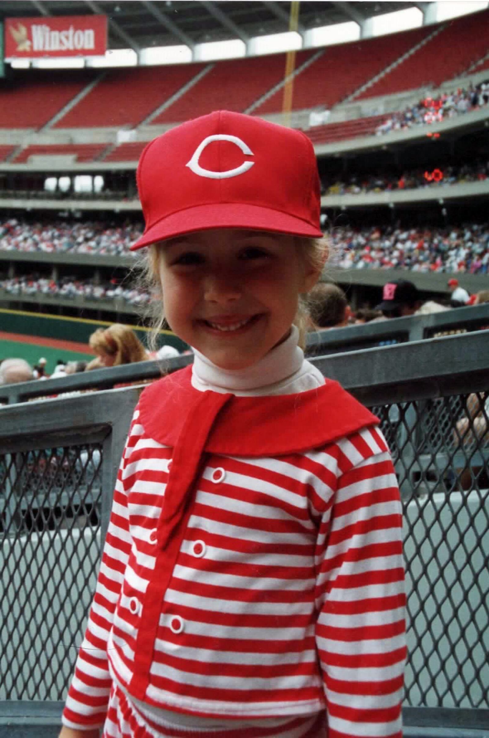 5-year-old Kristin Mann cheering on Barry Larkin at a Cincinnati Reds game in 1990. 