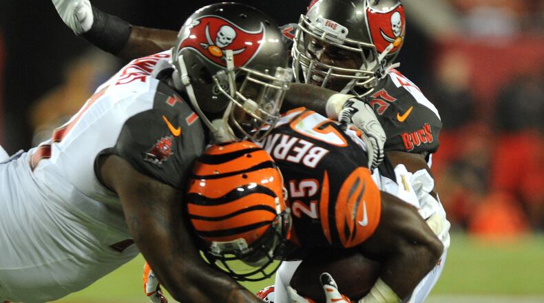 TAMPA, FL - AUGUST 24: Defensive end #71 Da'Quan Bowers tackles running back Giovani Bernard #25 of the Cincinnati Bengals in the second quarter at Raymond James Stadium on August 24, 2015 in Tampa, Florida. (Photo by Cliff McBride/Getty Images) *** Local Caption *** Da'Quan Bowers; Giovani Bernard