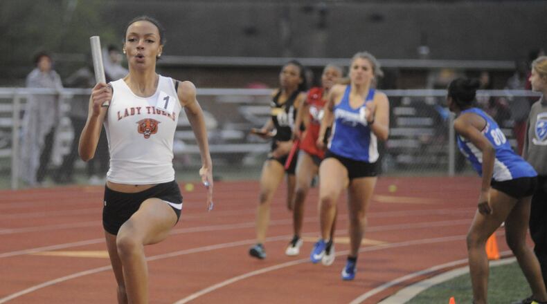 Stivers High School junior Paige Nooks-Flee (left) anchors the Tigers’ sprint medley relay to a heat win and fourth overall in the 800-meters sprint medley relay during the Wayne Warriors track and field invitational at Heidkamp Stadium on Tuesday. Lima Senior ran away with the girls team title, 91-69.5 over runner-up Wayne and No. 3 Northmont (68.5). Wayne (106.5) won the boys team title. Dunbar (81) was second and Northmont (69) third. For more of Tuesday’s high school sports highlights see View photos and video at DaytonDailyNews.com. MARC PENDLETON / STAFF