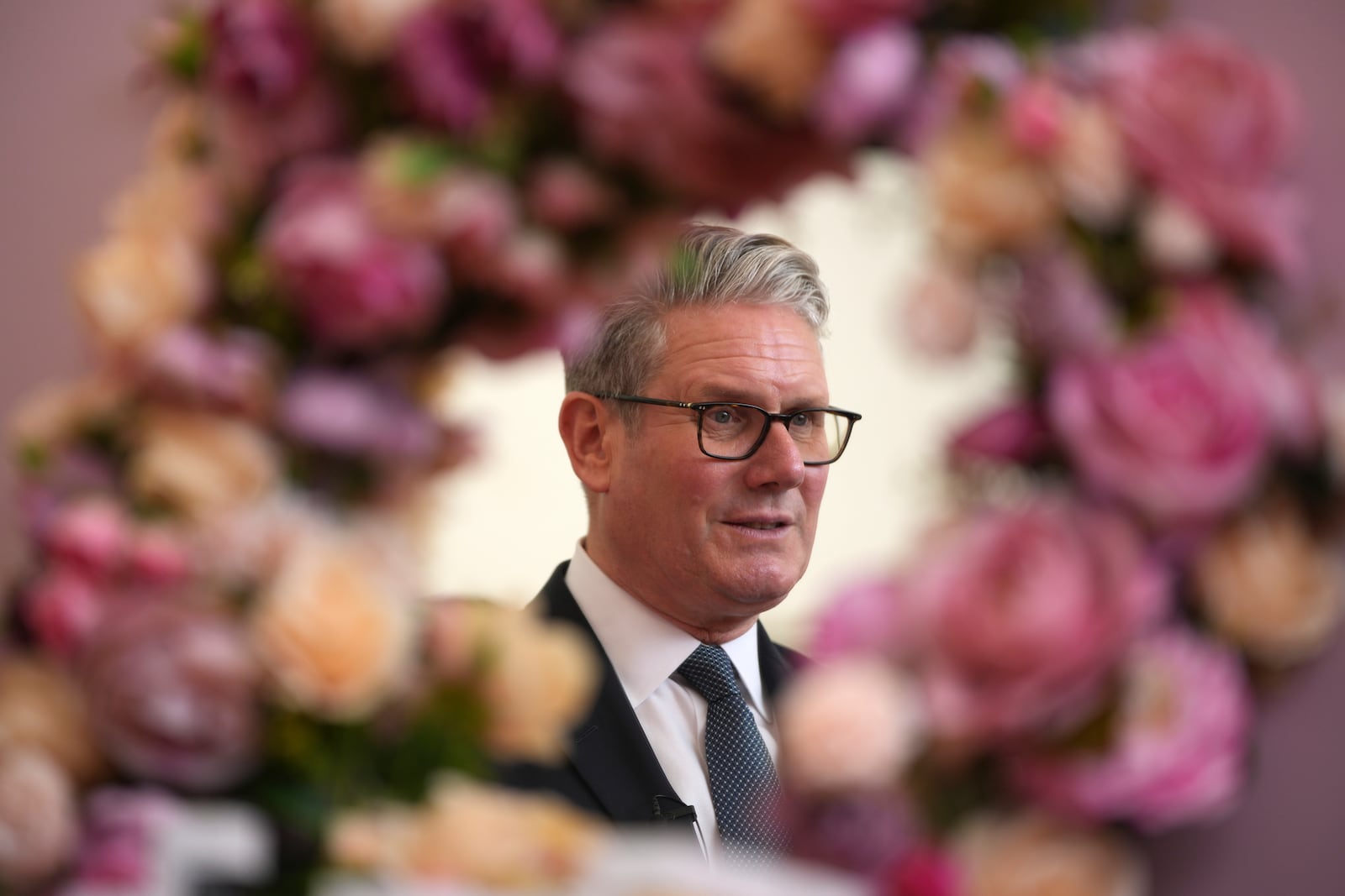 Britain's Prime Minister Keir Starmer is reflected in a mirror during a business showcase event whilst meeting Prime Minister Narendra Modi of India at Chequers near Aylesbury, England, Thursday, July 24, 2025.(AP Photo/Kin Cheung, Pool)