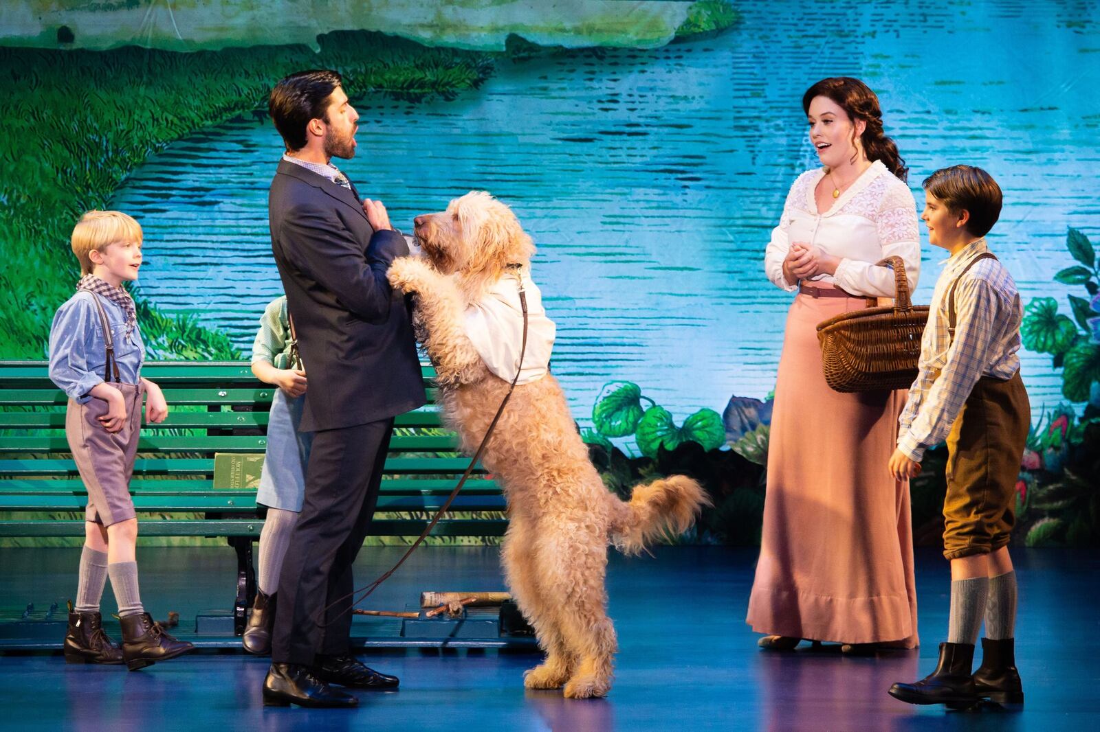 Ruby Gibbs (second from right) portrays the mother, Sylvia, in the touring production of “Finding Neverland.” CONTRIBUTED