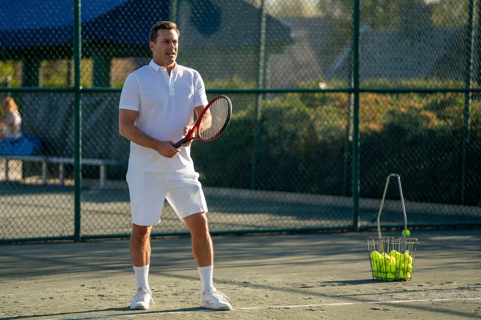 This image released by Apple TV+ shows Jon Hamm in a scene from "Your Friends & Neighbors." (Jessica Kourkounis/Apple TV+ via AP)