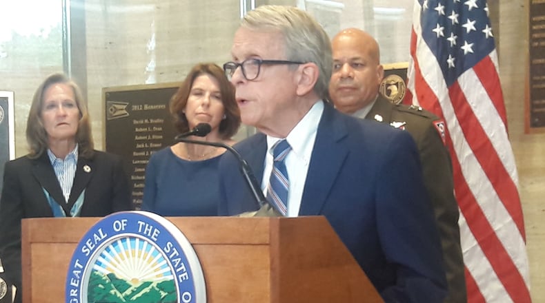 Gov. Mike DeWine speaks Monday, backed by Maj. Gen. (Ret.) Deborah Ashenhurst, Ohio Department of Veterans Services director; right, Lori Criss, Ohio Department of Mental Health and Addiction Services director; middle, and Maj. Gen. John Harris, Ohio adjutant general.