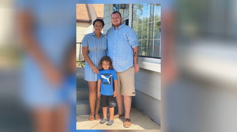 Gerrynn Snowcden (left) with her fiancé, Tommy Lambert. and their son, Urijah.
