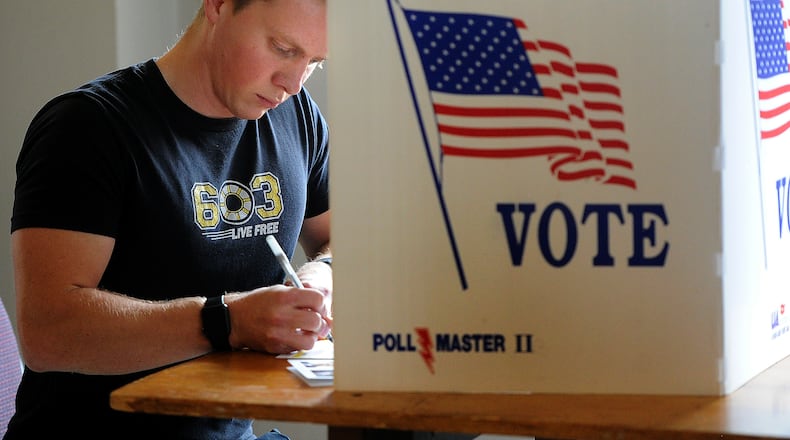 Nicholas Langenderfer votes Tuesday, Nov. 7, 2023 at the Masonic Center in Dayton. MARSHALL GORBY \STAFF