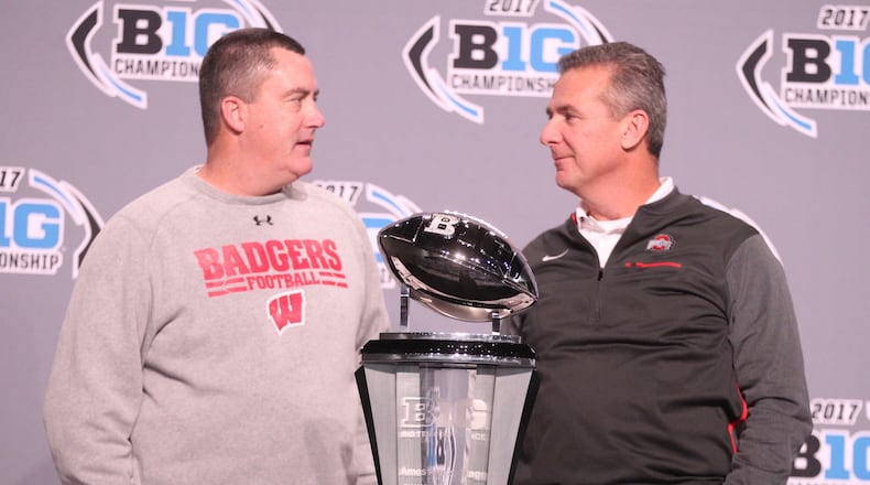 Wisconsin coach Paul Chryst and Ohio State's Urban Meyer talk a day before the 2017 Big Ten Championship game.