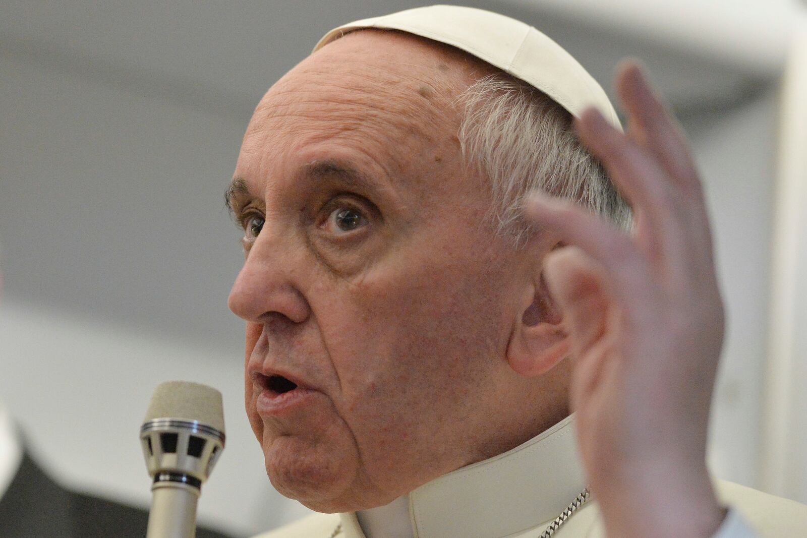 FILE - Pope Francis talks about gays saying he wouldn't judge priests for their sexual orientation in a remarkably open and wide-ranging news conference aboard the papal flight on the journey back from Brazil, on July 29, 2013. (AP Photo/Luca Zennaro, Pool, file)
