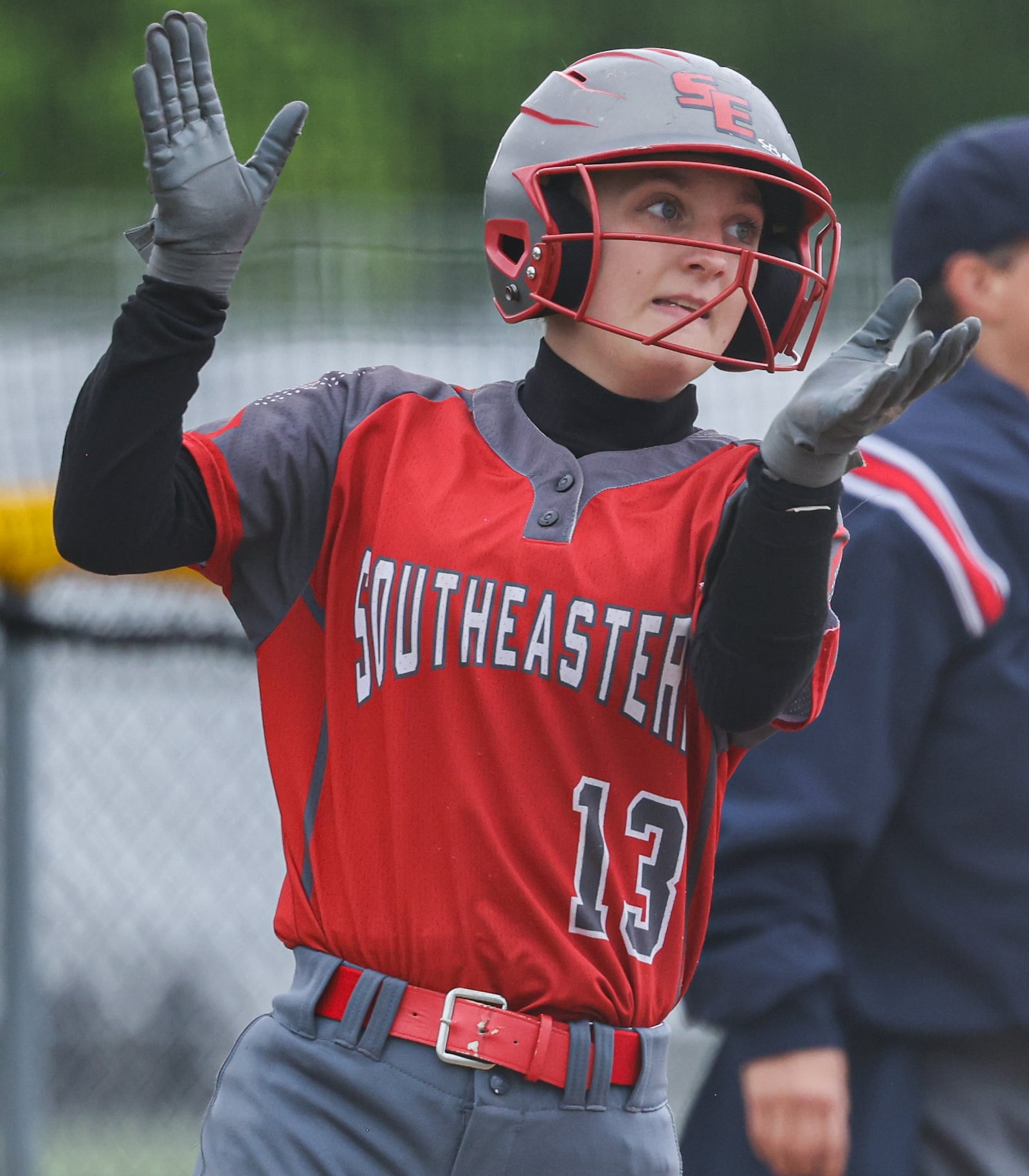 Southeastern junior Addi Vanover celebrates after scoring a run during a Division VII regional semifinal against Waynesfield-Goshen on Wednesday at Northmont High School. BRYANT BILLING / STAFF