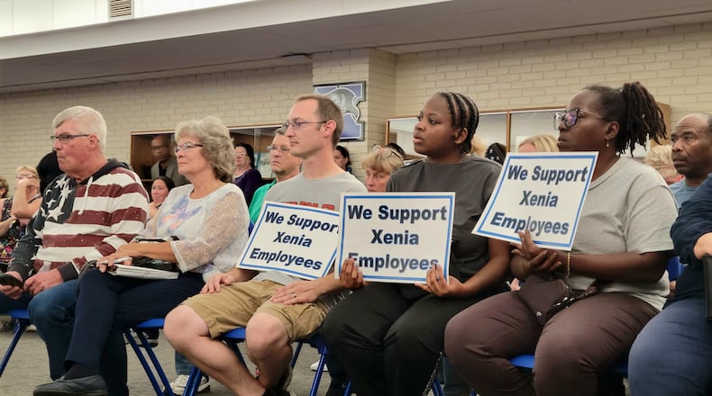 At a standing-room-only meeting of the Xenia Board of Education Monday, many in attendance held signs in support of Xenia teachers and educators, October 13, 2025. LONDON BISHOP/STAFF