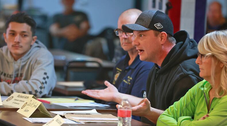 Springfield veteran David Smith talks about problems he is having with the Veterans Administration as he sits in a round table discussion with Senator Sherrod Brown and other veterans Wednesday, Jan. 11, 2023. BILL LACKEY/STAFF