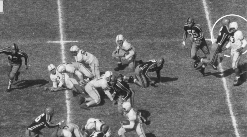 The premeditated, racially-motivated, jaw-breaking punch Oklahoma A & M defensive lineman Wilbanks Smith delivered on defenseless Drake quarterback Johnny Bright – an assault that happened away from the action after Bright had handed the ball to his running back in the October 20, 1951 game in Stillwater, Oklahoma – was captured on film (as were two other cheap shot hits on Bright that knocked him unconscious) by Des Moines Register photographers John Robinson and Doug Ultang. A six-photo sequence of the assaults ran across the top of the Des Moines sports page the next day and was picked up and run in newspapers across the nation as well as being featured in Life and Look magazines. Robinson and Ultang won the Pulitzer Prize in 1952 for their photos. JOHN ROBINSON AND DOUG ULTANG / DES MOINES REGISTER AND DRAKE UNIVERSITY