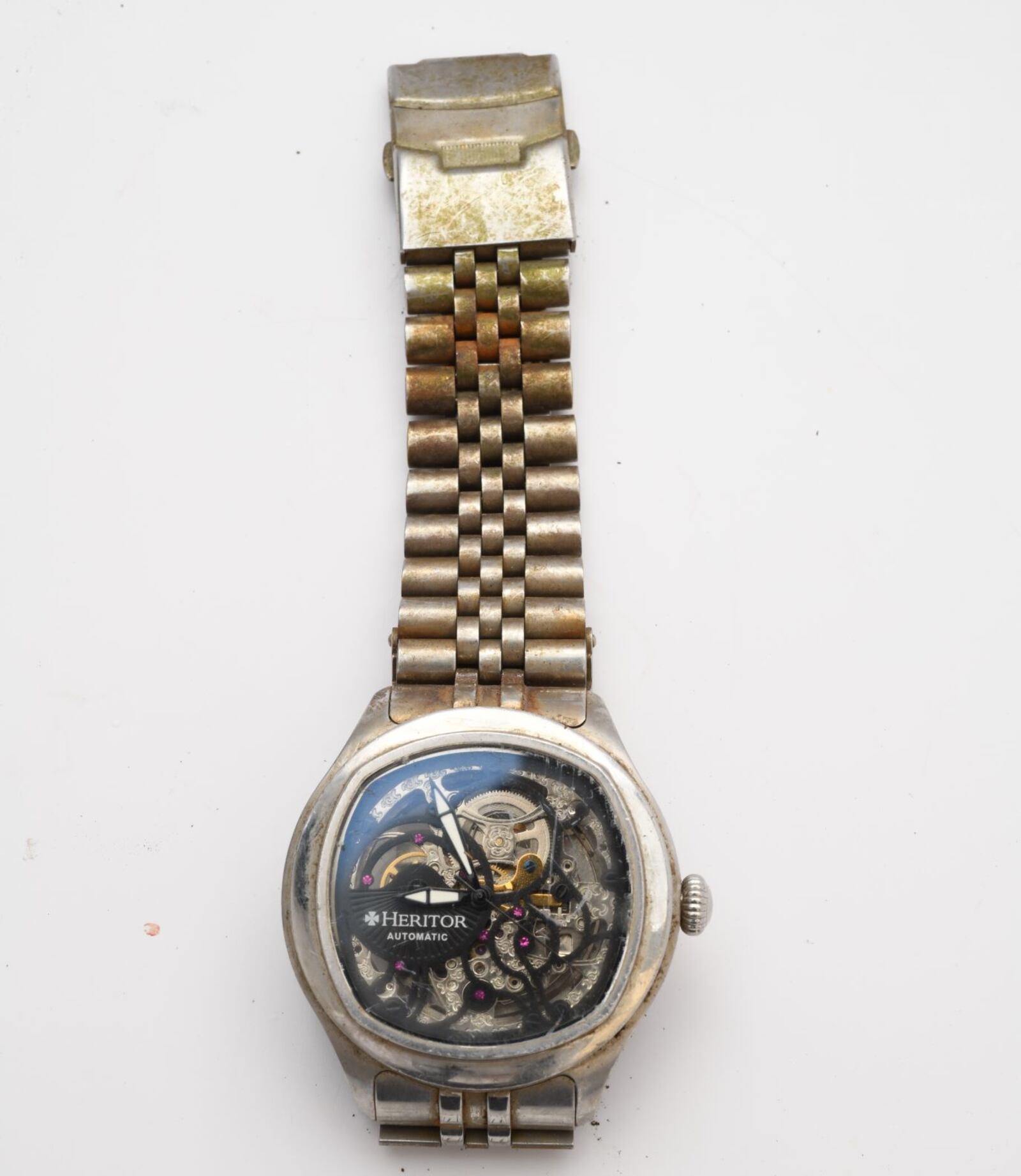A Heritor watch was found with skeletal remains found in a wooded area on Shelby Avenue in Dayton on Nov. 22, 2023. The Montgomery County Coroner's Office is asking for the public's help identifying the man.