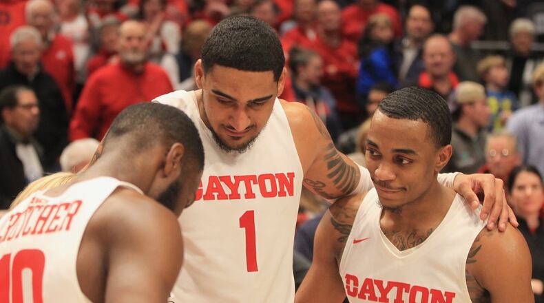 Dayton’s Rodney Chatman, right, does a postgame interview with Jalen Crutcher, left, and Obi Toppin with ESPN’s Holly Rowe after a victory against Davidson on Friday, Feb. 28, 2020, at UD Arena. David Jablonski/Staff
