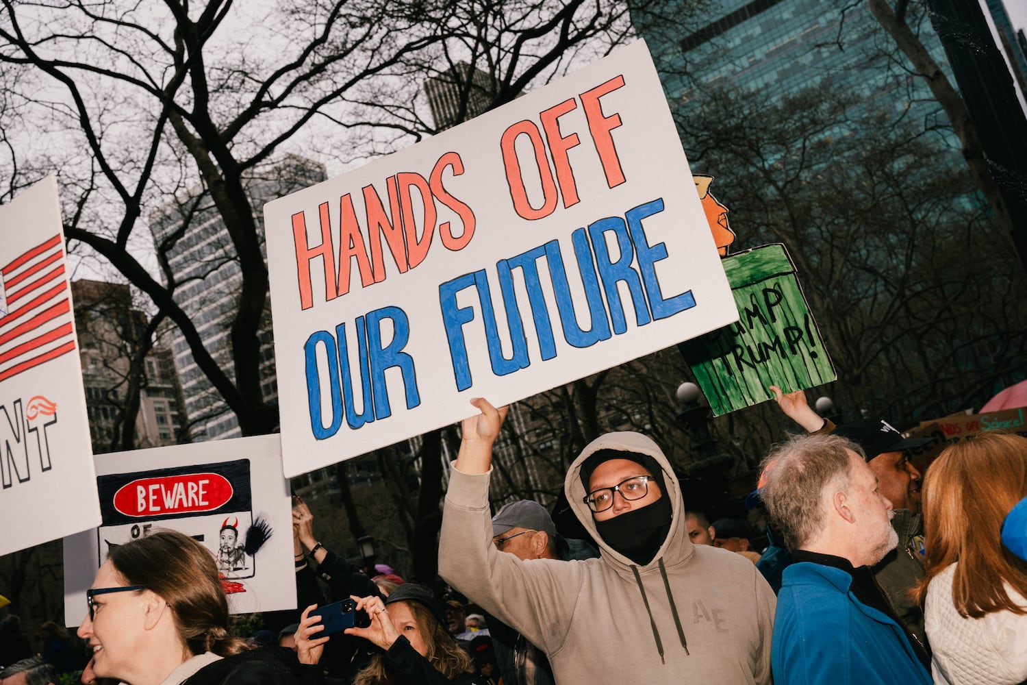 Protesters march near Bryant Park, during nationwide ÒHands Off!Ó demonstrations against President Donald TrumpÕs administration, on Saturday, April 5, 2025. (Paola Chapdelaine/The New York Times)