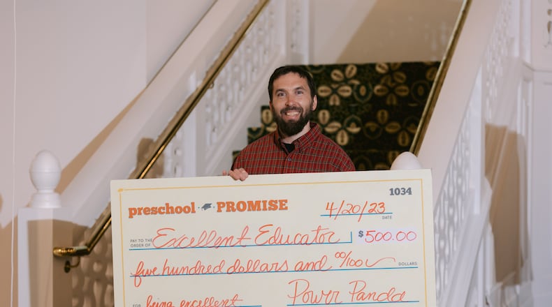 Male Educator of the year, Yunus Brevik from Fairview Elementary School, holds up the $500 check he was awarded for his work at Fairview Elementary School at Preschool Promise's annual awards ceremony last Thursday. Courtesy of Preschool Promise.