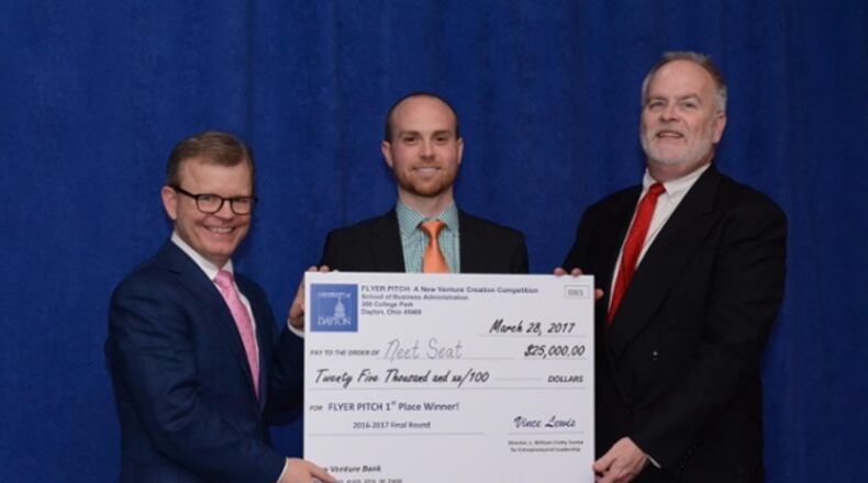 Zach McHale is presented with the top prize of $25,000 in the University of Dayton’s 11th annual Flyer Pitch competition.