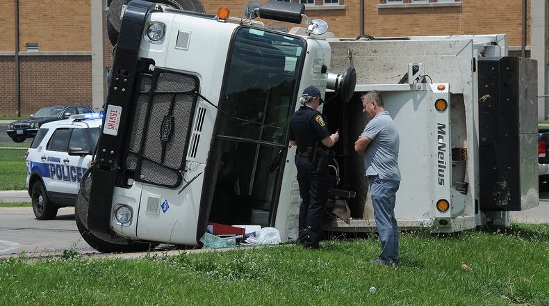 A trash truck overturned on the ramp to Route 4 off Harshman Road in Riverside Thursday June 16, 2022. MARSHALL GORBY\STAFF