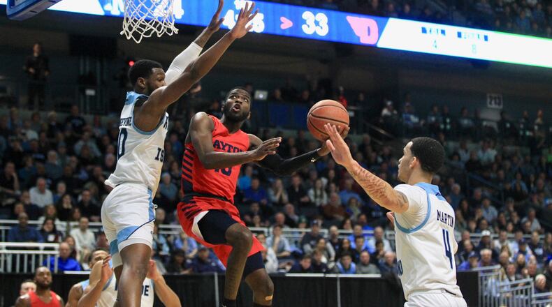 Dayton's Jalen Crutcher scores against Rhode Island in the first half on Wednesday, March 4, 2020, at the Ryan Center in Kingston, R.I.