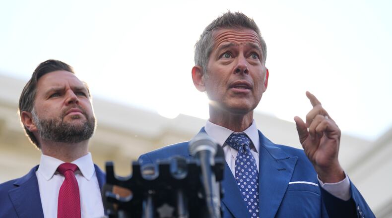 Transportation Secretary Sean Duffy speaks alongside Vice President JD Vance about the impact of the government shutdown on the aviation industry, outside of the West Wing of the White House, Thursday, Oct. 30, 2025, in Washington. (AP Photo/Jacquelyn Martin)