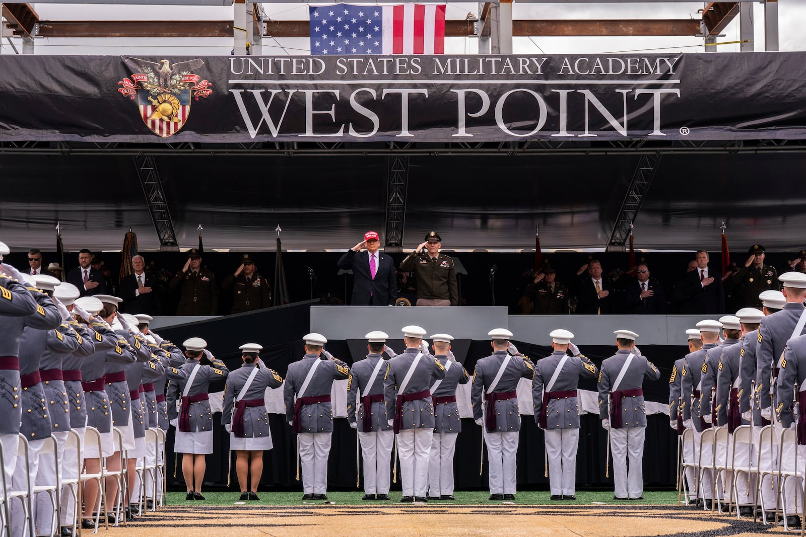 President Donald Trump salutes alongside Lieutenant General Steven W. Gilland during the U.S. Military Academy commencement ceremonies in West Point, N.Y., Saturday, May 24, 2025. (AP Photo/Adam Gray)