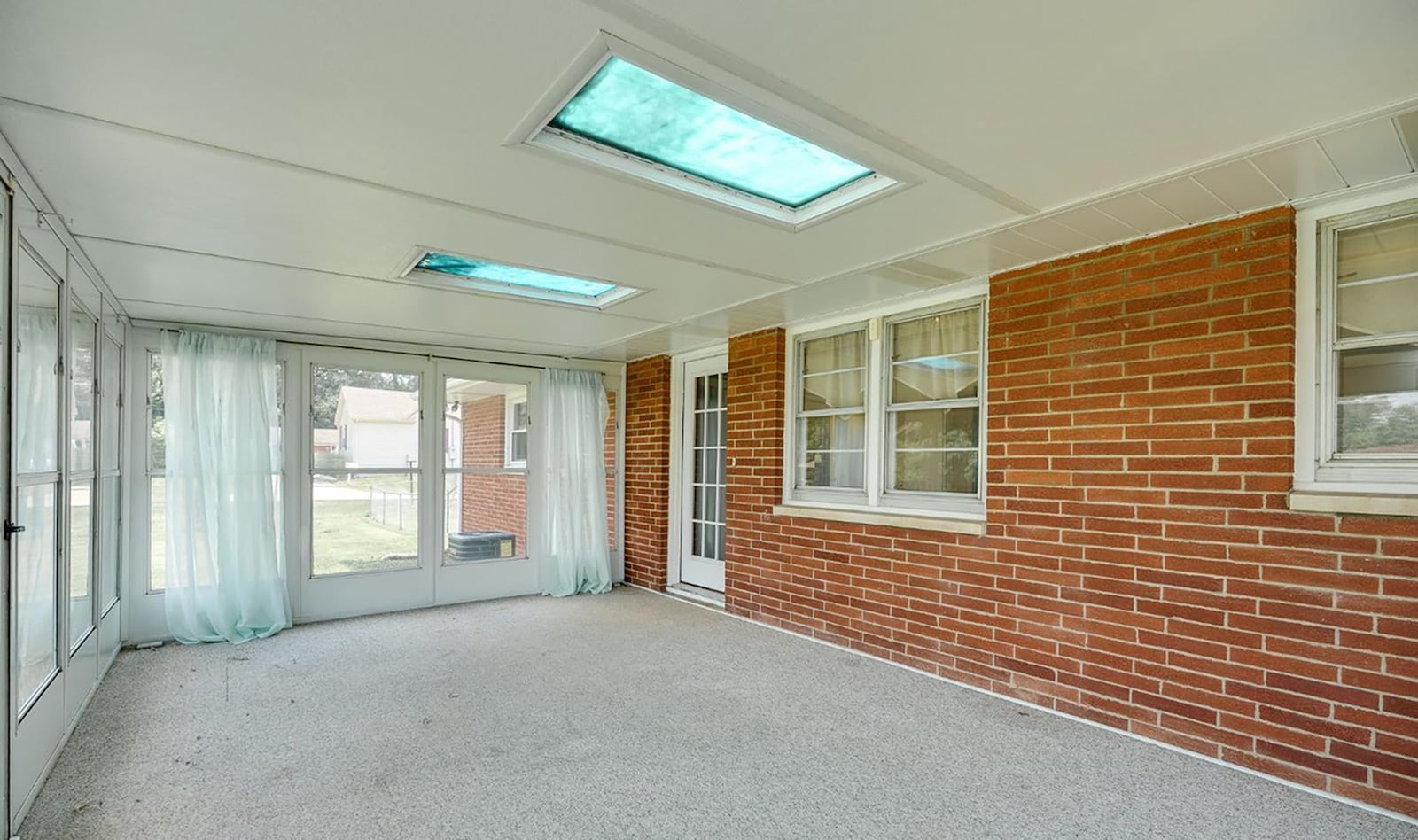 Off the kitchen is a sunroom with carpeting and two exterior doors opening to the back yard. CONTRIBUTED