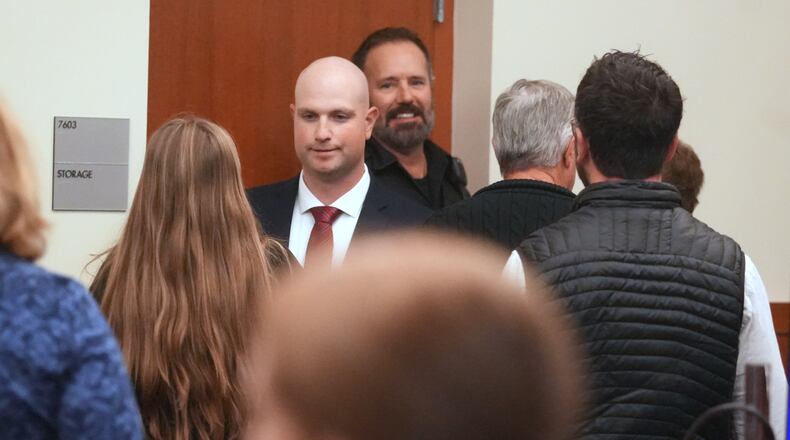 FILE - Blendon Township police officer Connor Grubb greets a family member Nov. 21, 2025 after the not guilty verdict is read at Franklin County Common Pleas Court in Columbus, Ohio on Friday, Nov. 21, 2025. (Doral Chenoweth/The Columbus Dispatch via AP, Pool, File)