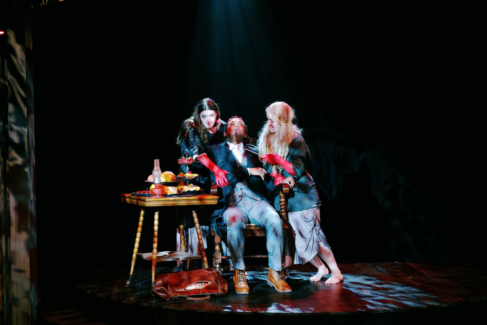 Left to right: Evelyn Vordtriede (Drusilla/Miller/Merchant), Andrew Ian Adams (Jonathan Harker) and Skye Hodgkin (Marilla/Maid) in the Human Race Theatre Company's production of "Dracula: A Feminist Revenge Fantasy, Really." Photo by William Peake