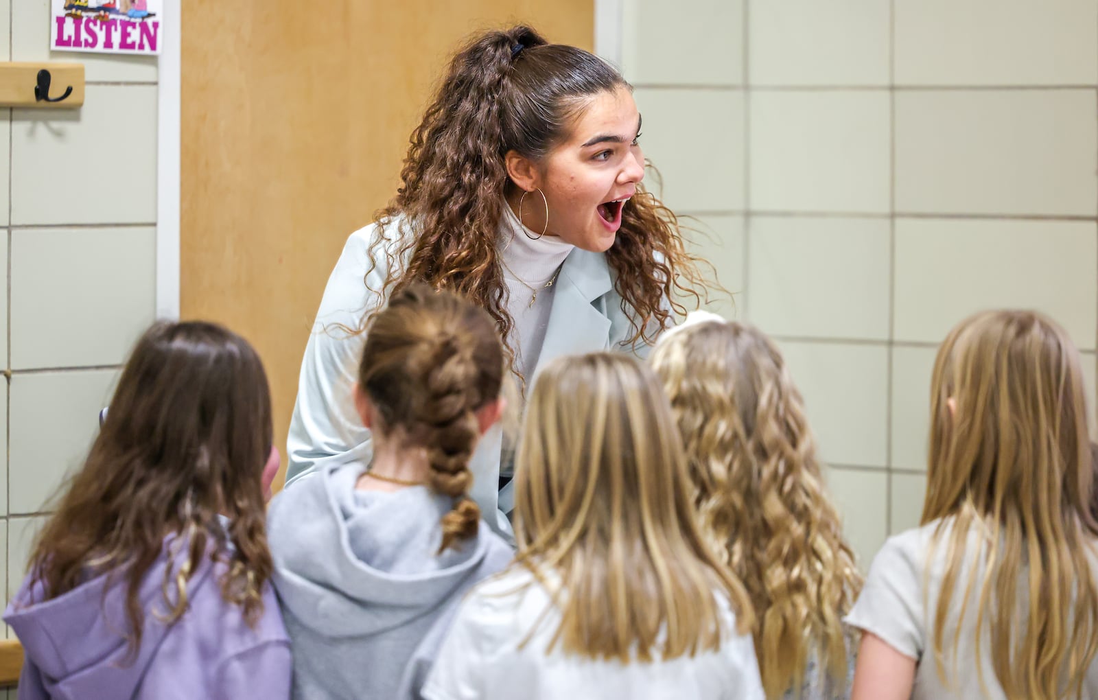 Maddy Westbeld, a Fairmont graduate who plays professional basketball for Chicago Sky, reacts while signing autographs for students after speaking to an afternoon assembly at J.E. Prass Elementary School in Kettering on Friday, Dec. 12. BRYANT BILLING/STAFF