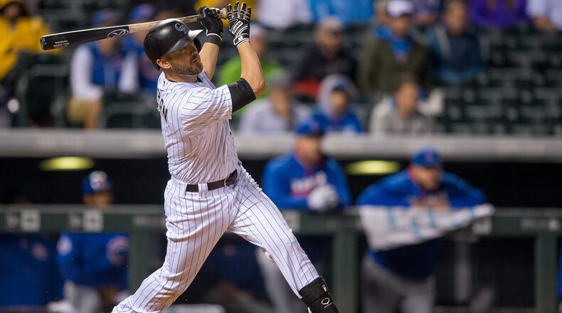 DENVER, CO - AUGUST 20: Ryan Raburn #6 of the Colorado Rockies hits an 11th inning walk off double to go ahead of the Chicago Cubs 7-6 and win at Coors Field early in the morning on August 20, 2016 in Denver, Colorado. (Photo by Dustin Bradford/Getty Images)