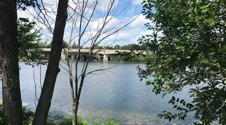 Volunteers have helped clean the banks of the lake near Lakeside Drive and South Gettysburg Avenue in the Pineview neighborhood. CORNELIUS FROLIK / STAFF