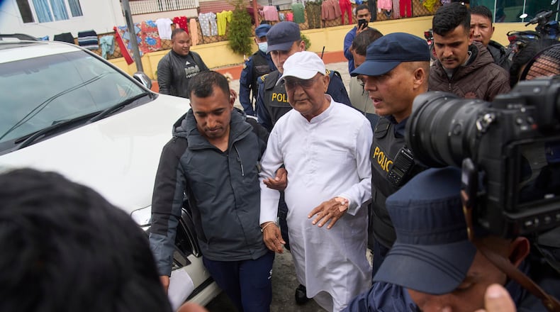 Former Prime Minister Khadga Prasad Oli is taken for procedural medical checkup after he was arrested by police in Kathmandu, Nepal, Saturday, March 28, 2026. (AP Photo/Niranjan Shrestha)