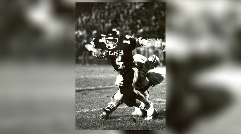 As a junior in 1986 (seen here against Fairmont), Herbstreit set a Centerville record with 317 passing yards in a game. That Elks team went 10-1 with a playoff appearance. DDN FILE