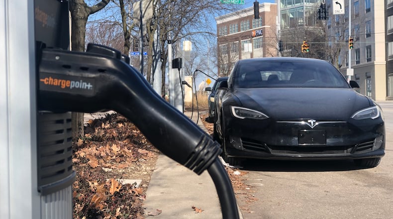An electric vehicle charging station across from the Day Air Ballpark, where the Dayton Dragons play, in downtown Dayton. CORNELIUS FROLIK / STAFF