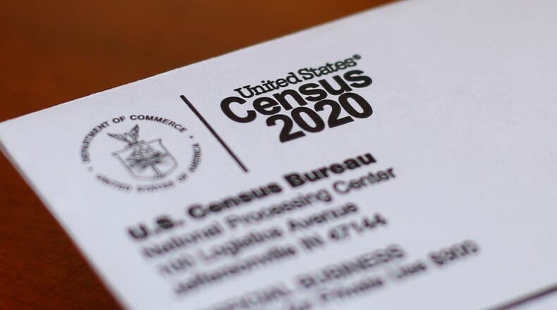 FILE  - This Sunday, April 5, 2020, file photo, shows an envelope containing a 2020 census letter mailed to a U.S. resident in Detroit.  A U.S. Census Bureau director couldn't be fired without cause and new questions to the census form would have to be vetted by Congress under proposed legislation which attempts to prevent in the future the type of political interference into the nation's head count that took place during the Trump administration. (AP Photo/Paul Sancya, File)