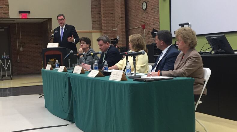 Sinclair Community College President Steven Johnson, far left, moderates a panel discussion in Oelman Hall for Wright State’s presidential search. Seated from left: state Sen. Peggy Lehner, R-Kettering; state Rep. Mike Duffey, R-Worthington; University of Toledo President Sharon Gaber; Inter-University Council of Ohio President Bruce Johnson and Bowling Green State University President Mary Ellen Mazey. MAX FILBY / STAFF